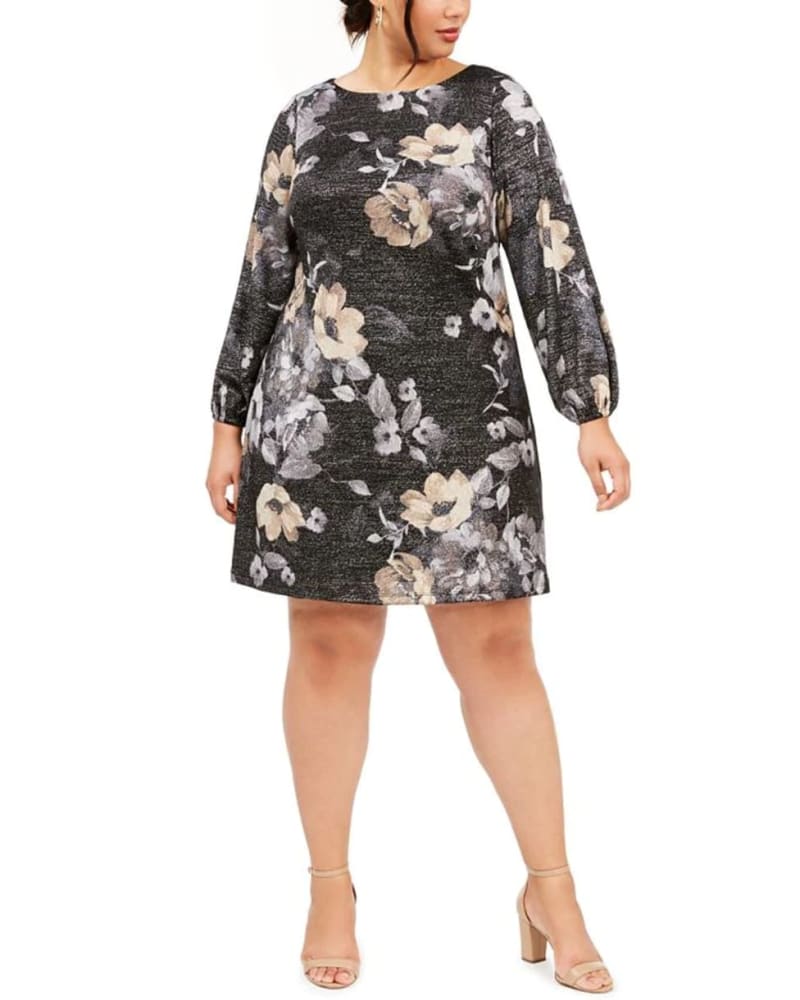 Front of a model wearing a size 14W Jessica Howard Women's Plus Metallic Floral Print a Line Dress Silver Size 14W in Gray by Jessica Howard. | dia_product_style_image_id:313336